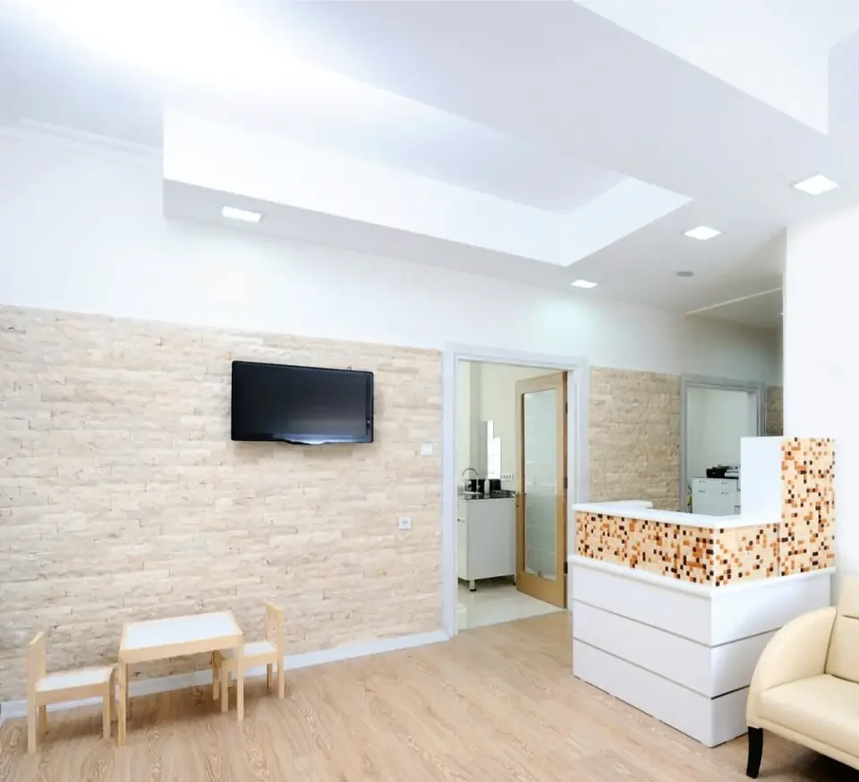 Reception and waiting area with a stone feature wall
