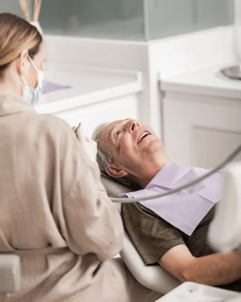 Patient reclining in the dental chair during an examination