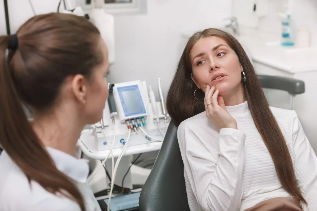 Anxious patient talking with a dentist